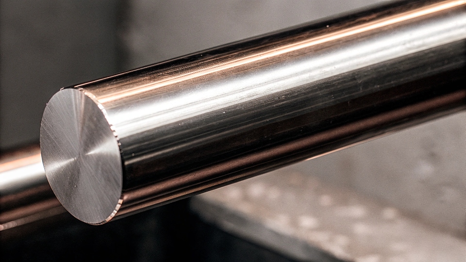 A close-up of a steel bar with 316L marking on it