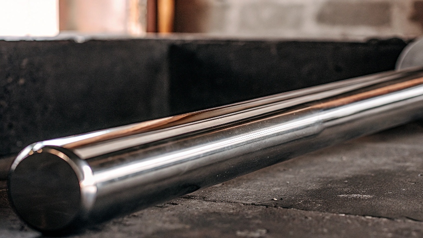 A polished titanium bar highlighting its strength