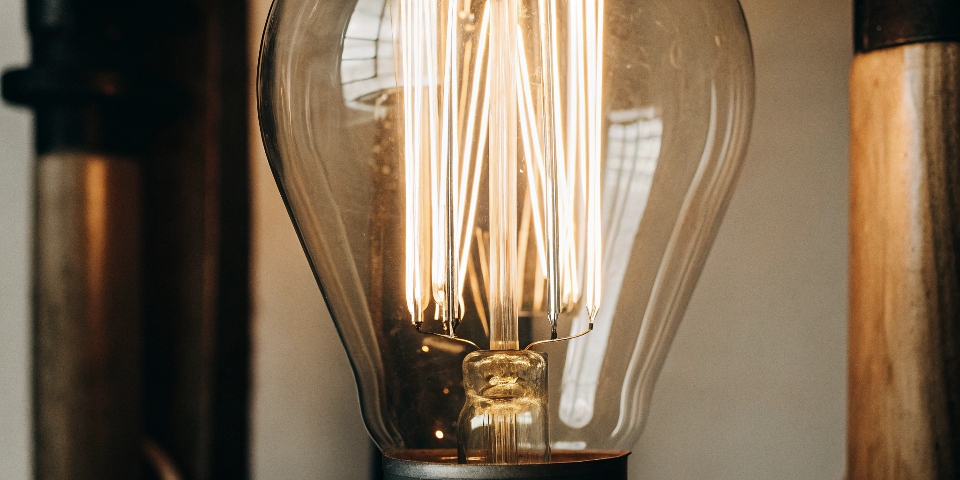 A glowing tungsten filament in a light bulb