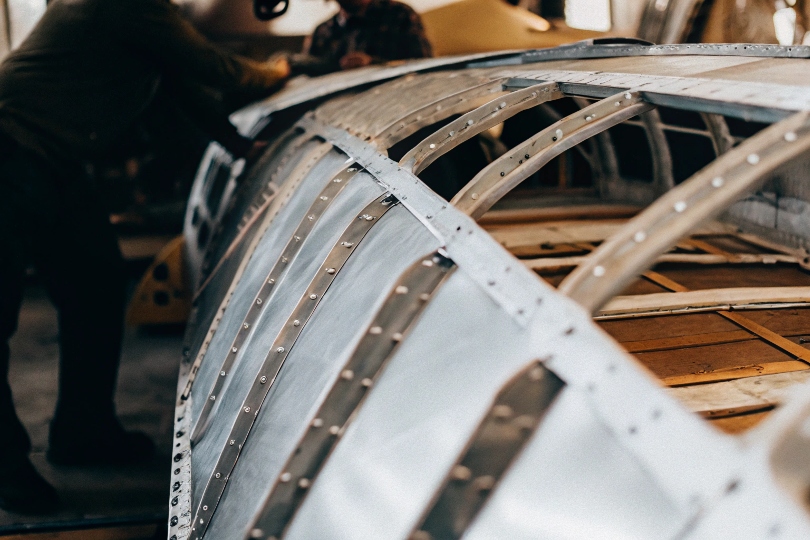 An image showing the skin of an aircraft wing being assembled from large sheets of metal