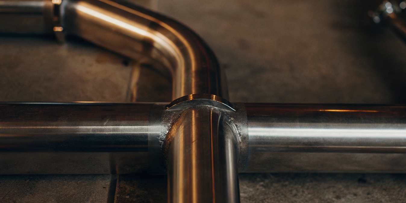 A close-up of a clean, perfect titanium weld with a silvery finish.
