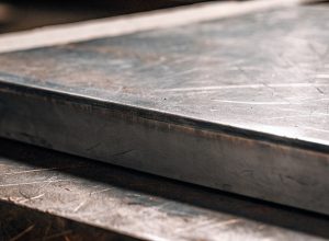 Close-up of protective titanium surface with minor scratches showing corrosion resistance property